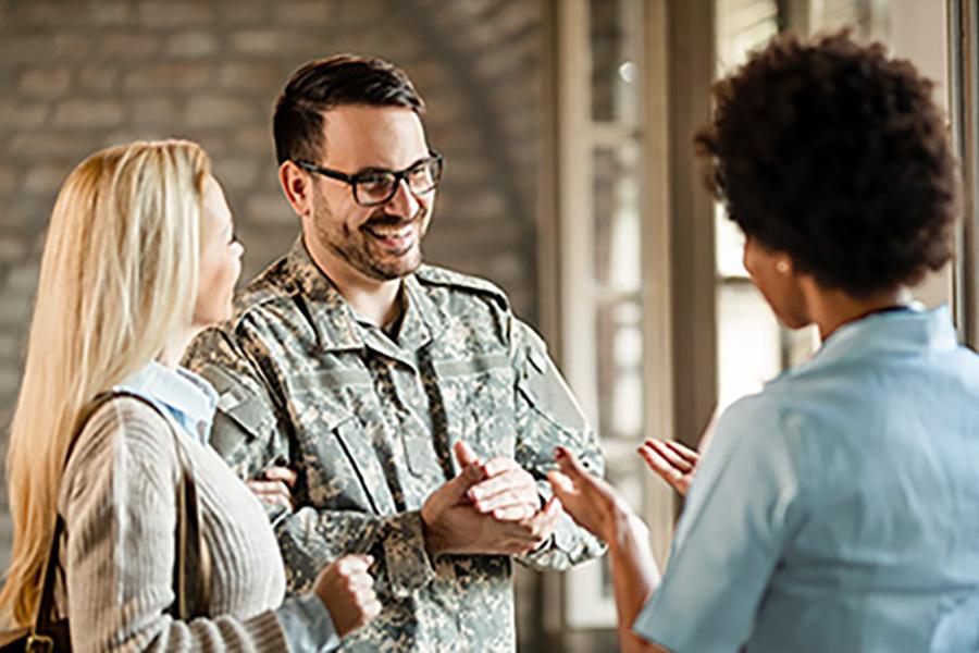 A veteran family meeting meeting with a classroom teacher